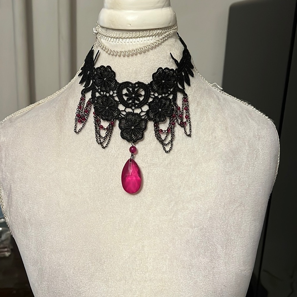 Black lace choker with pink pendant and accents